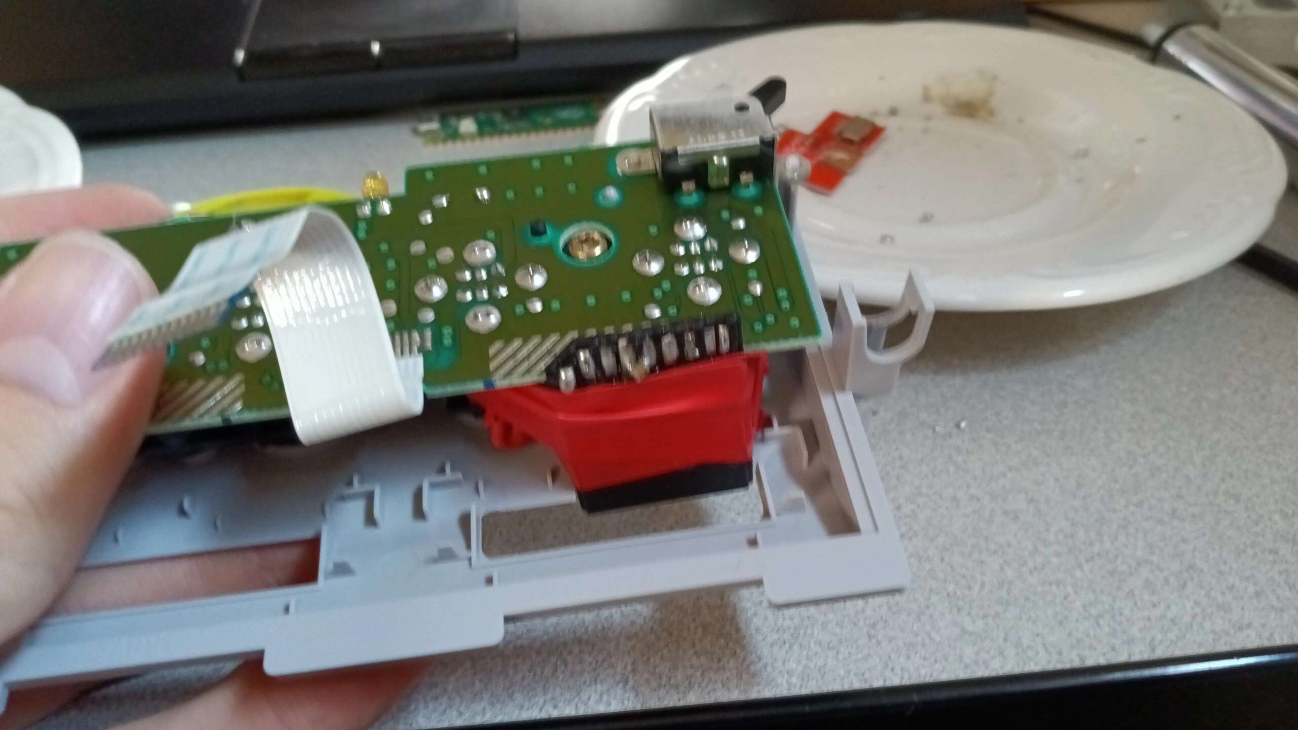 SD card haphazardly secured with electrical tape wrapped around the controller ports